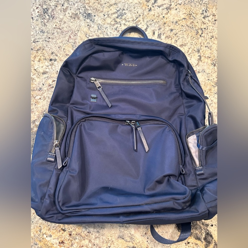 Gently used Tumi Carson navy backpack